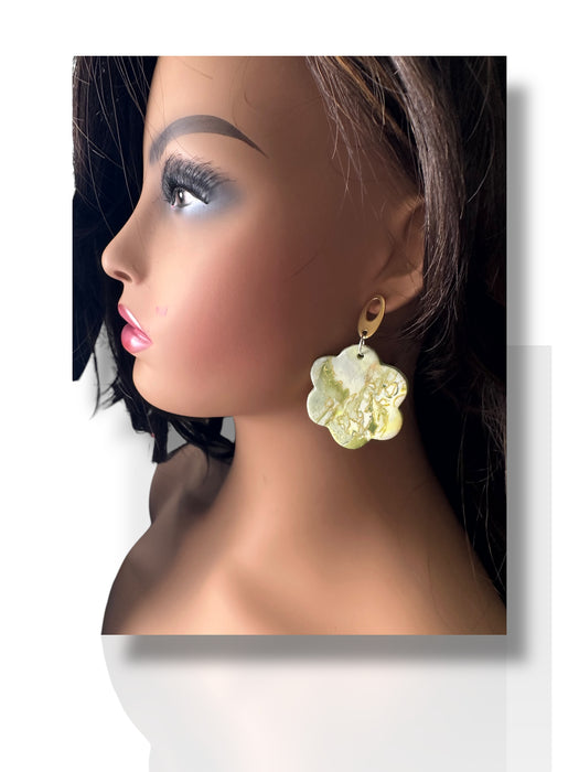 Dangle earring with white polymer clay flower and gold hoop on mannequin head with dark hair. - Handmade Modern Earrings, Three Different Flower Design, Dangle Earrings, Black and White Earrings, Green and Gold Earrings, Polymer Clay Earrings - Black & White