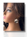 Handmade black and white polymer clay flower dangle earring on mannequin head. - Handmade Modern Earrings, Three Different Flower Design, Dangle Earrings, Black and White Earrings, Green and Gold Earrings, Polymer Clay Earrings - Black & White