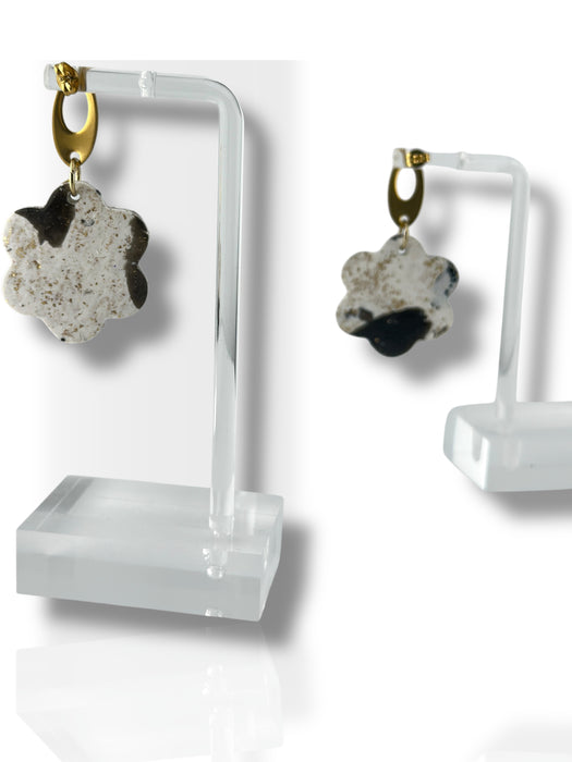 Dangle earrings featuring black and white flower-shaped polymer clay charms with gold hooks on clear acrylic stands. - Handmade Modern Earrings, Three Different Flower Design, Dangle Earrings, Black and White Earrings, Green and Gold Earrings, Polymer Clay Earrings - Black & White