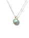 Gold necklace with a pendant featuring a pearl 