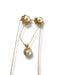 Gold pendant with a central gemstone 